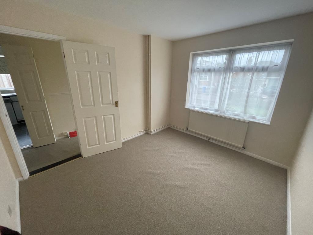 Lot: 101 - DETACHED BUNGALOW FOR IMPROVEMENT - Bedroom with window looking to road